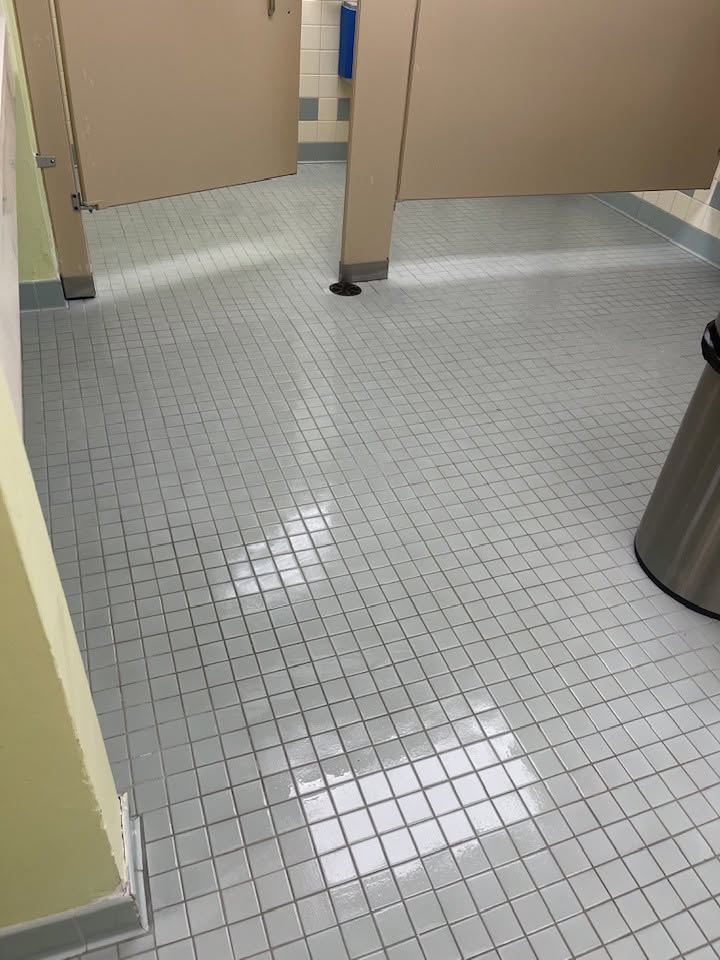 Commercial restroom tile floor after cleaning