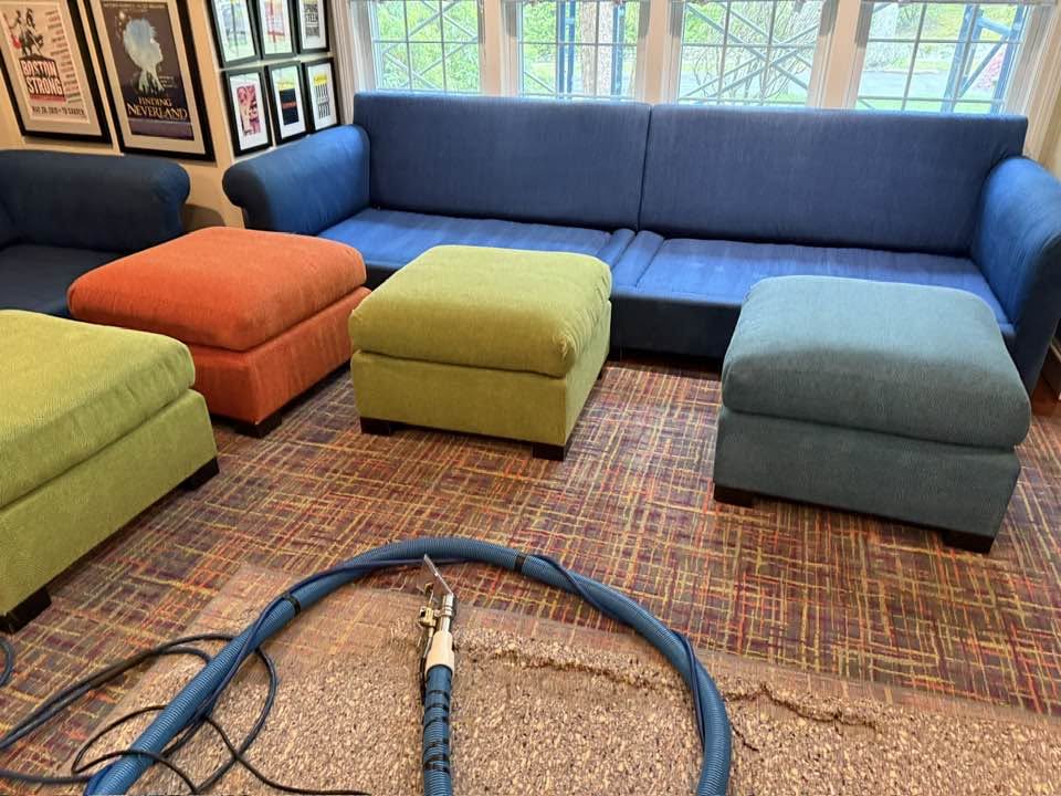 Colorful sofa and ottomans during upholstery cleaning
